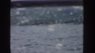 Idaho USA (1955): Window Of Boat Roaming Water Showing Greenery Of Hill Around