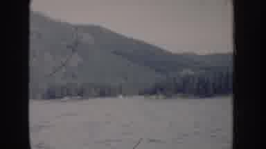 Idaho USA (1955): Choppy Waters Sailing On Lake Surrounded By Forest And Mountains