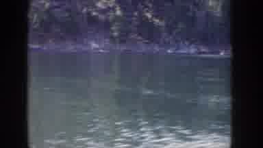 Idaho USA (1955): Panoramic View From Boat In Rural Area Ending With Man Riding