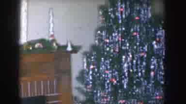 Nebraska USA (1955): Father In Chair Smoking Cigarette Near Christmas Tree And
