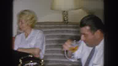 Nebraska USA (1955): Husband And Wife Visiting With Friends