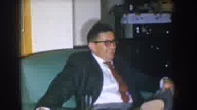 Nebraska USA (1955): 1960'S Man Holding Cigarette, Takes A Drink, Removes Glasses