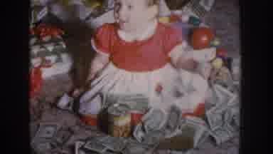 Nebraska USA (1955): Baby Has Cans And Money Sitting Near Christmas Gifts