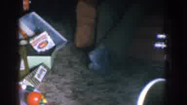 Nebraska USA (1955): Baby Receives Christmas Gift During The Holidays From Family