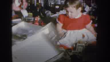 Nebraska USA (1955): Grandma And Baby Playing With Money In Front Of Liquor