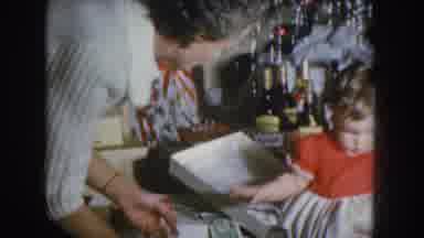 Nebraska USA (1955): Child Take The Paper And Mother Pick Up The Box