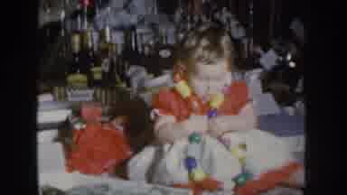 Nebraska USA (1955): Baby Playing With A Huge Necklace