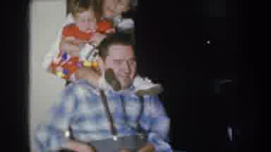 Nebraska USA (1955): Baby Red Dress Sitting Dad Back Cute Family Mom Love
