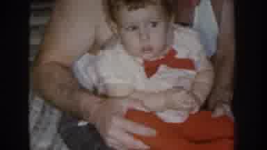 Nebraska USA (1955): Baby In A White Shirt With Red Pants And A Red Bow Tie Is