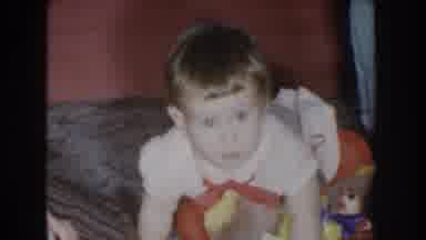Nebraska USA (1955): A Toddler Dressed In Red And White Falling On The Ground And