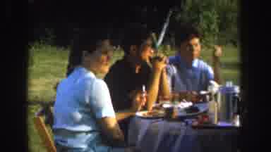 Nebraska USA (1955): Three People Outdoors Eating And Having Fun And Look Very