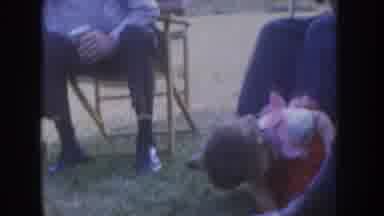 Nebraska USA (1955): Cute Baby Played In A Garden, And Some Mans Sitting In A