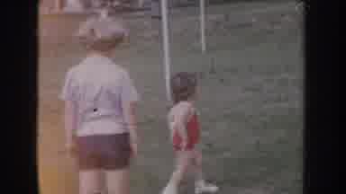 Nebraska USA (1955): Kids In Playground Having Fun On Sunny Day, Girl In Red