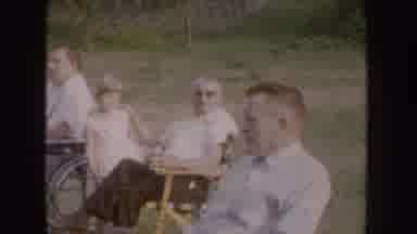 Nebraska USA (1955): Group Of Adults And Children Gathered Together One In