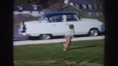 Nebraska USA (1956): The Little Boy Playing In The Garden And Touch The Car Also