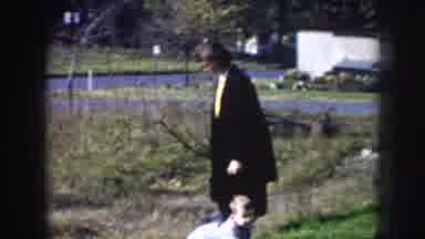 Nebraska USA (1956): Toddler Slides Down Hill, Almost Hits Water
