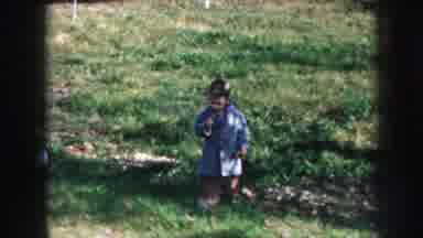 Nebraska USA (1956): One Kid Is Getting Toy From One Lady And Playing With The
