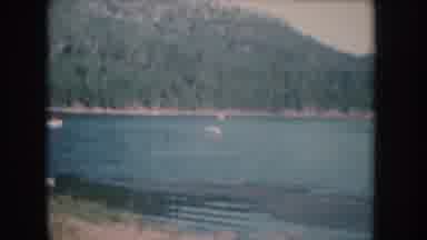 South Dakota USA (1956): People Swimming And Water Skiing On A Lake Surrounded By