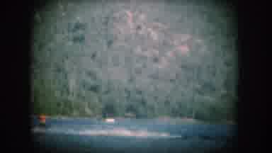 South Dakota USA (1956): Skiing On A Lake, Surrounded By Pines In The Height Of