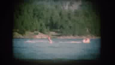South Dakota USA (1956): People At A Lake Water Skiing And Picking Leaves Off A