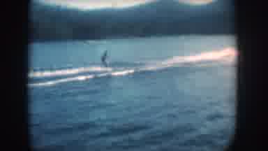South Dakota USA (1956): An Individual Skiing On Water Skis Across A Lake Behind A
