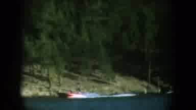 South Dakota USA (1956): Looking At A Boat Pulling A Water Skier On A Lake
