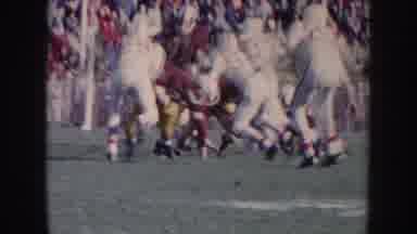 Nebraska USA (1957): American Football Game Start Of Play Showing Multiple Players