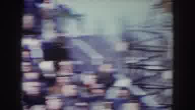 Nebraska USA (1957): Camera Pans Over A Crowd Of People Standing Outside A Long