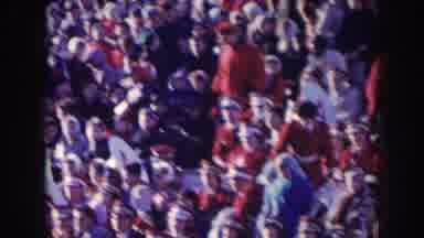 Nebraska USA (1957): Stadium Crowd Wearing Red And White At Daytime Football Game