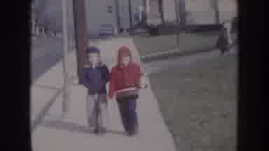 Nebraska USA (1957): Kids Walking On The Suburban Sidewalk