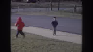 Nebraska USA (1957): One Child With A Red Hooded Holding A Ball And Running