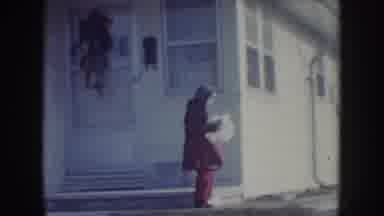 Nebraska USA (1957): Woman In Wheelchair And Children In Front Of Yellow House