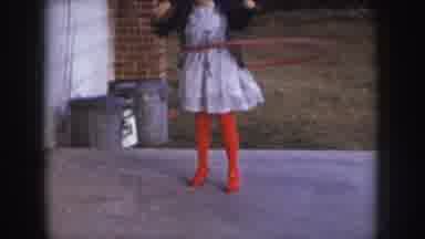 Nebraska USA (1957): White Girl Red Pants Wiggling Near Trash Can Grey Floor