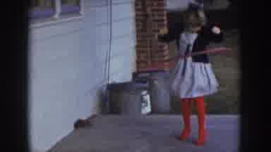 Nebraska USA (1957): Little Girl Hula Hooping On Porch In Front Of House