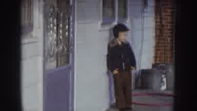 Nebraska USA (1957): A Little Boy Watching A Little Girl Dance On A Cement Porch