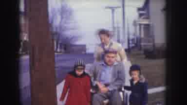 Nebraska USA (1957): Woman In 1950s Style Clothes Pushing Man In Wheelchair While