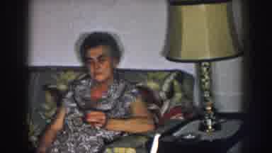 Nebraska USA-1957: Family Gathering On Floral Couch With Grandma