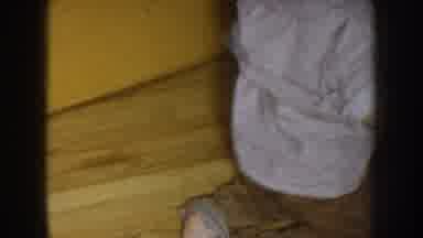 Nebraska USA (1957): Brunette Toddler Wearing Dress Shirt And Brown Pants Running