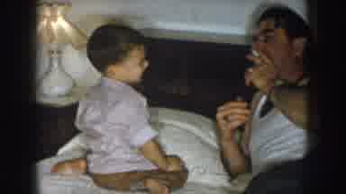 Nebraska USA (1957): Father Smoking In Bed With Son