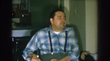 Nebraska USA (1957): A Man Sitting In A Wheelchair Talks To A Couple Sitting On A