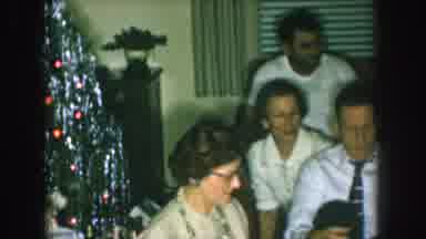 Nebraska USA (1957): Family Gathers Around Television Set On Christmas Eve