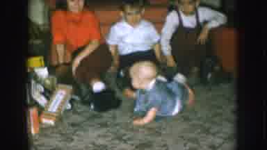 Nebraska USA (1957): Two Brothers And A Sister Interact With A New Baby Sibling In