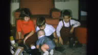Nebraska USA (1957): Three Small Children Sitting On The Floor Together As A Baby