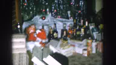 Nebraska USA (1957): Family Chilling In Living Room At Christmas Under A Christmas