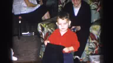 Nebraska USA (1957): Child Being Presented With Toys