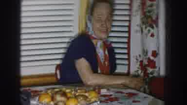Nebraska USA (1957): Smiling Woman Sitting On A Table While 3 Man Are In The