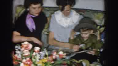Nebraska USA (1957): Family Looking At Pictures On A Old Video Recorder Family