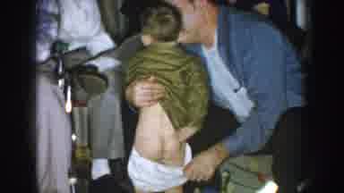 Nebraska USA (1957): A Man Pulls Down The Underwear Of A Young Boy Who Pulls Them
