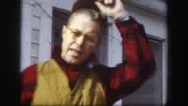 Kansas USA (1958): A Man Is Talking To A Camera While Playing With His Hat And