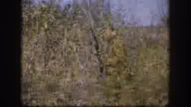 Kansas USA (1958): Man That Looks Like A Hunter Walking In The Bushes